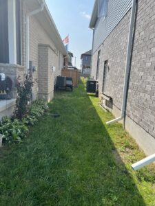 landscape project French Drain connections between the house, prior to brick installation